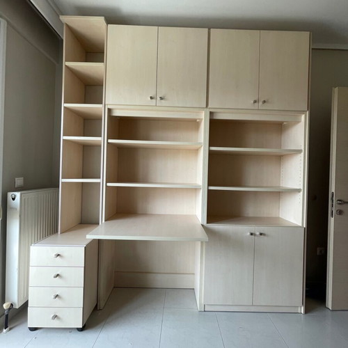 Bookcase desk with shelves, cabinets, drawers and office chair used