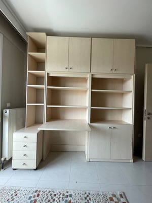 Bookcase desk with shelves, cabinets, drawers and office chair used