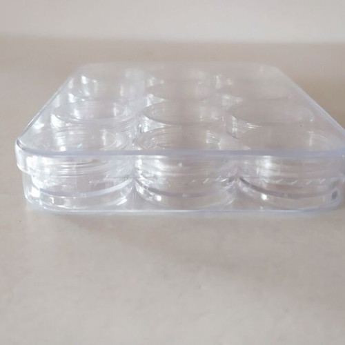 Transparent circular capsules like new, box of 12 pieces