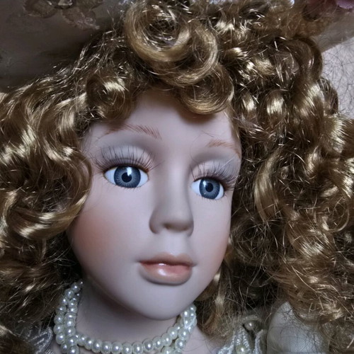 Glass Bride Doll like new with lace dress and hat