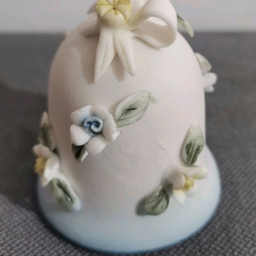 Ceramic bell used with embossed flower designs