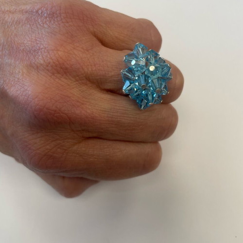 3D ring with bright blue moving crystals like new