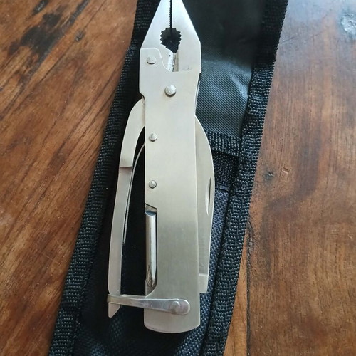 Folding stainless steel multitool new with case