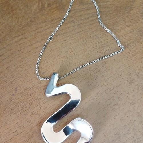 Silver necklace with wave-shaped snake pendant like new