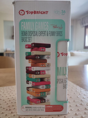 Wooden skill game Jenga type used, missing one brown block
