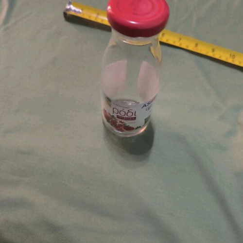 Empty decorative glass bottle like new with cap