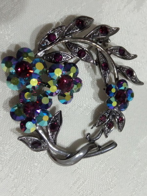 Pin used with carved details and multicolored stones