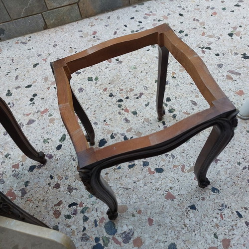 Vintage side tables pair with natural marble used