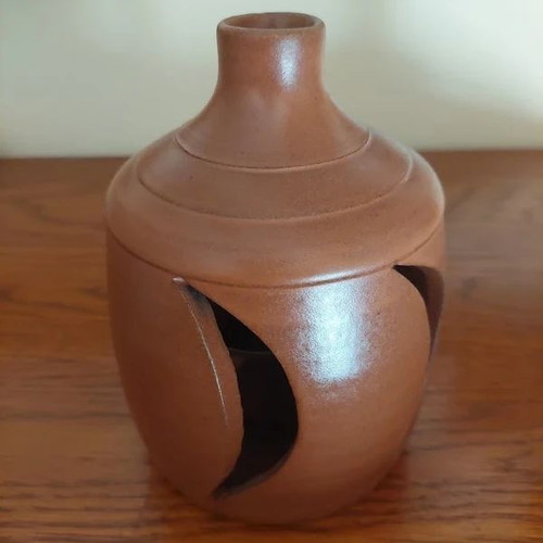 Ceramic Candle Holder like new, terracotta cut-out design