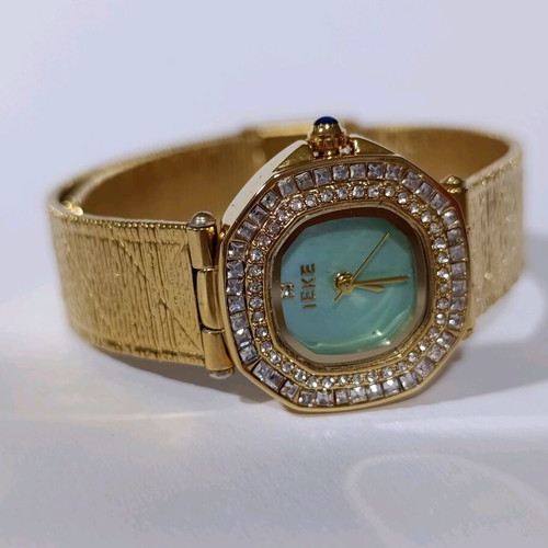 Ieke women's watch new, gold with turquoise dial and double rhinestones