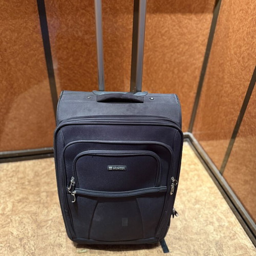 Hunter black trolley suitcase used with telescopic handle