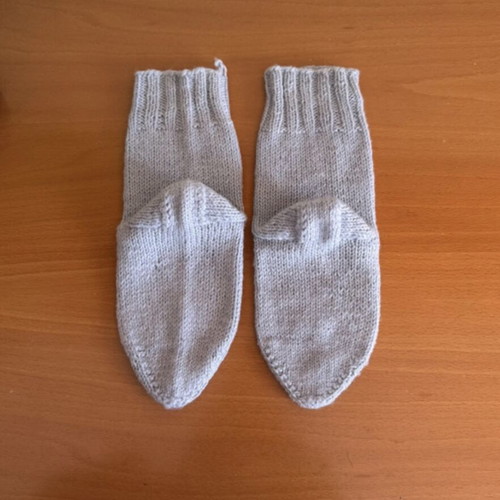 Handmade woolen socks in soft light blue color, new