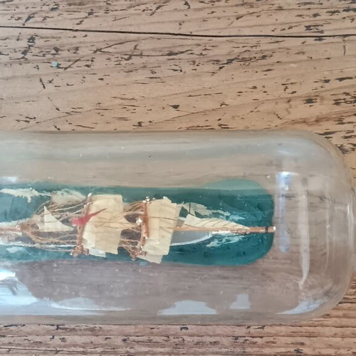 Vintage decorative ship in glass bottle used
