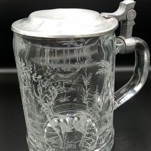 Glass beer mug with embossed hunting design like new from West Germany