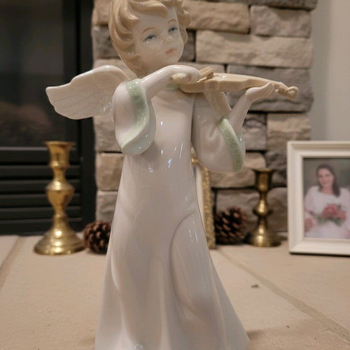 Porcelain angel figurine playing violin