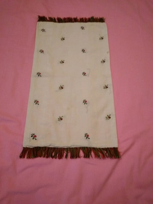 Woven table runner used with small woven flowers and fringe