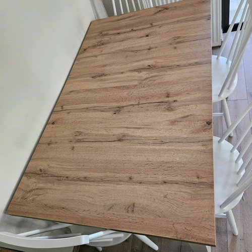 Extendable table used with folding mechanism and deco veneer surface