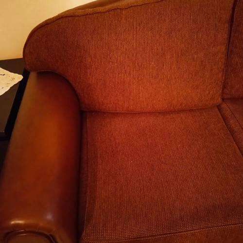 Two-seater sofa used, leatherette with fabric