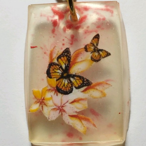 Handmade butterfly keychain from resin like new, white multicolor