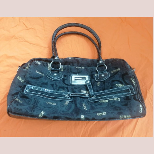 Guess vintage black handheld bag used with silver and gold details