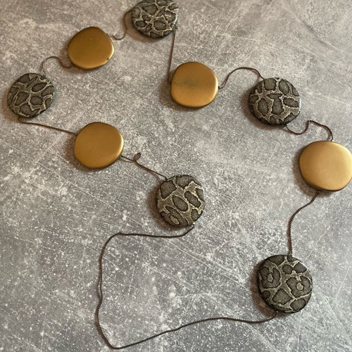 Necklace used with round gold and silver designs