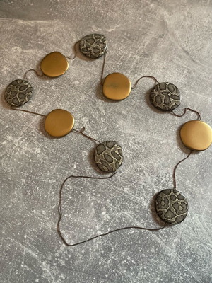 Necklace used with round gold and silver designs