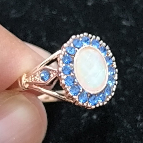 Rose Gold women's ring with white opal and blue crystals, stainless steel