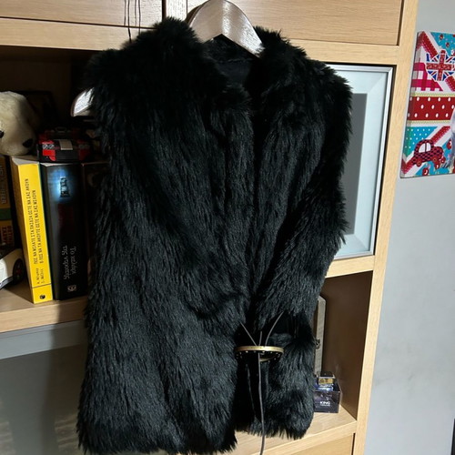 Sleeveless fur vest used, synthetic black short