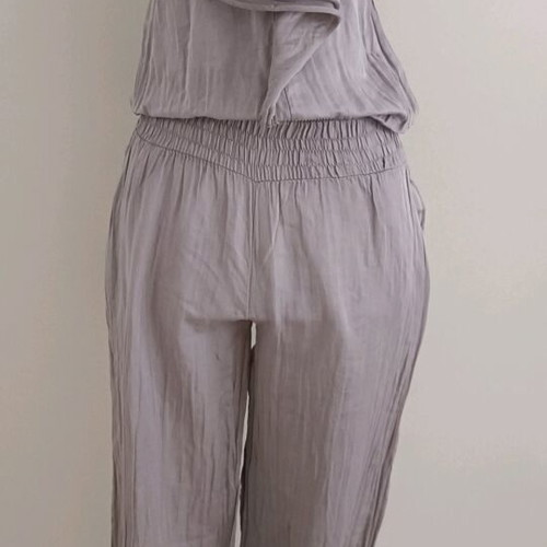 Strapless jumpsuit used, gray brown with bow and ruffles