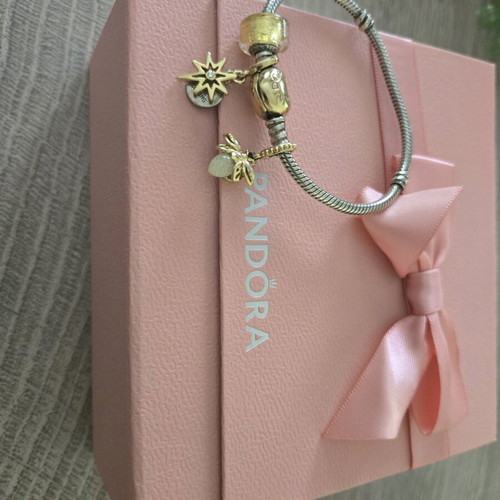 Pandora authentic bracelet like new with 3 gift charms silver and gold