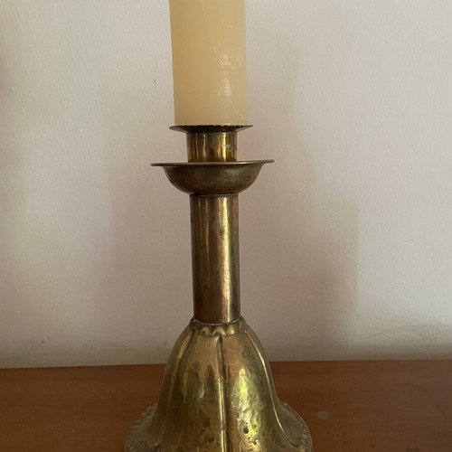 Handmade antique candlestick over 100 years old, brass with hammered details, used