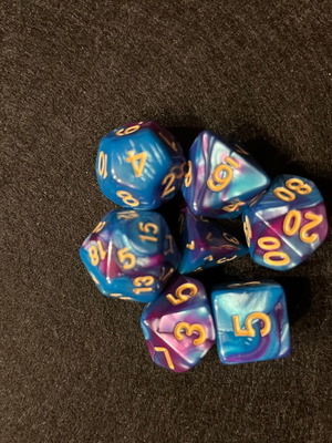 Blue and purple D&D dice set with dice bag