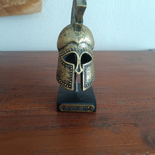 Decorative replica of ancient Greek Corinthian helmet used, bronze patina