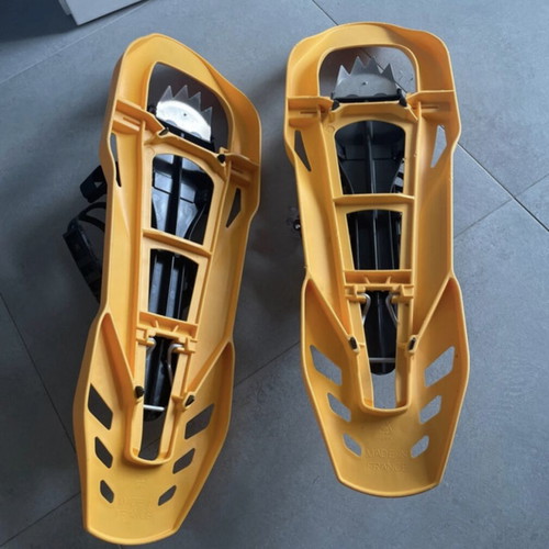 Sneka snowshoes used for hiking with metal crampons
