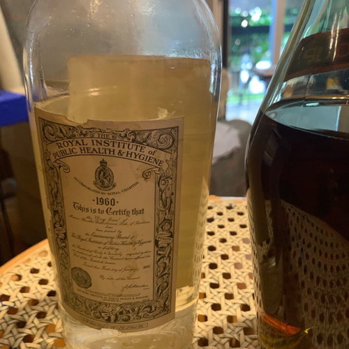 Hennessy cognac 1950 and gin 1960 bottles unopened
