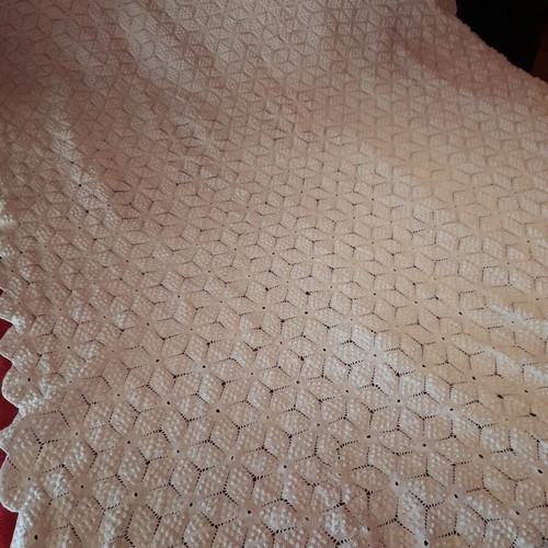 Handmade white crochet blanket in vintage style