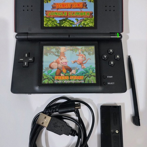 Nintendo DS Lite console with Pokemon LeafGreen cartridge used