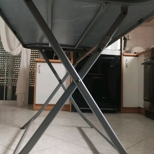 Outdoor table with glass top and metal used