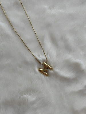 Monogram necklace new, gold color