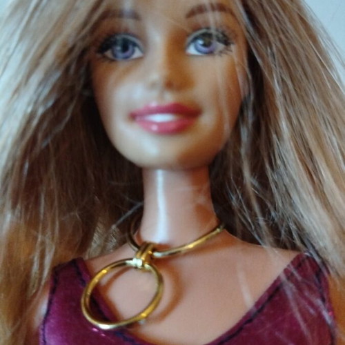 Barbie doll like new with purple dress and gold necklace from 2009 collection