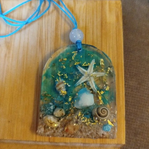 Handmade pendant with liquid glass and sea elements new, beige and blue
