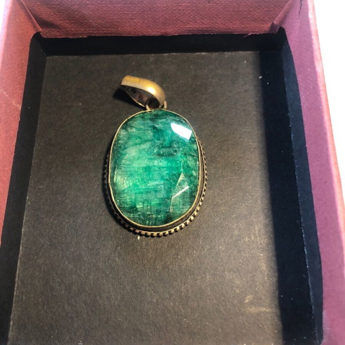 Necklace of smelted emerald like new with black ribbon