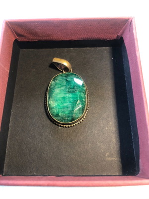 Necklace of smelted emerald like new with black ribbon