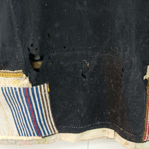 Traditional collectible wool dress used with wear due to age