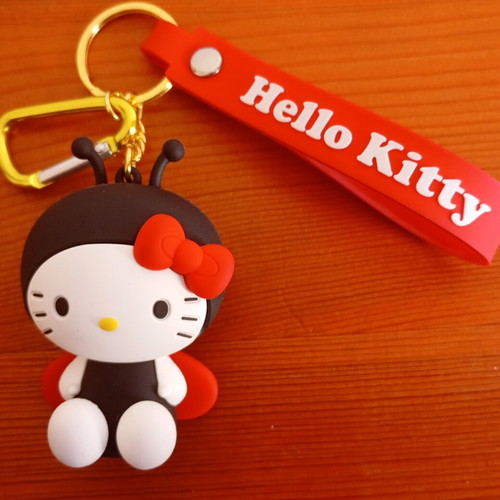 Hello Kitty ladybug keychain like new, black and red