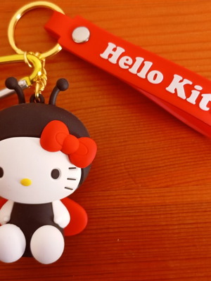 Hello Kitty ladybug keychain like new, black and red