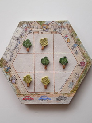 Ceramic handmade tic-tac-toe new on hexagonal terracotta tile