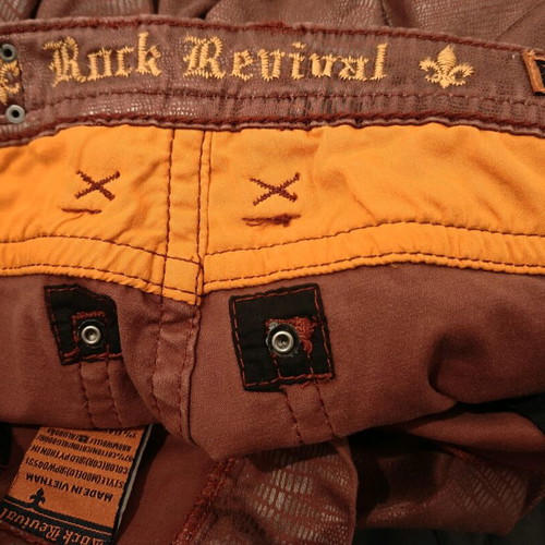 Rock Revival women's low rise red snake embossed denim jeans used