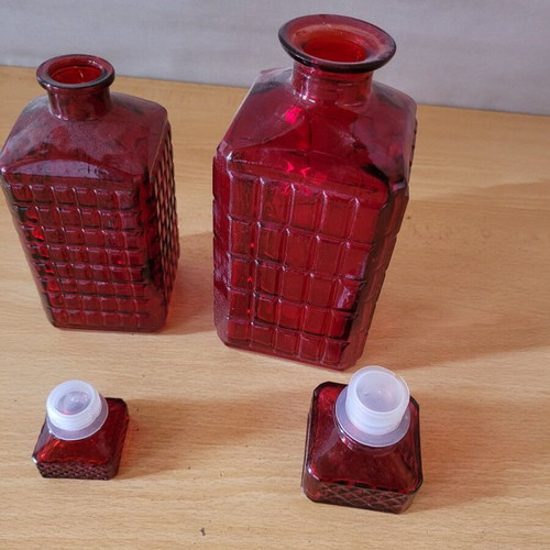 Decorative red glass pitchers and vases like new