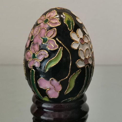Cloisonne egg used with white and pink cherry blossoms on wooden base